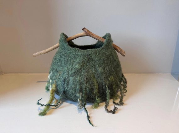 A basket made of green felt