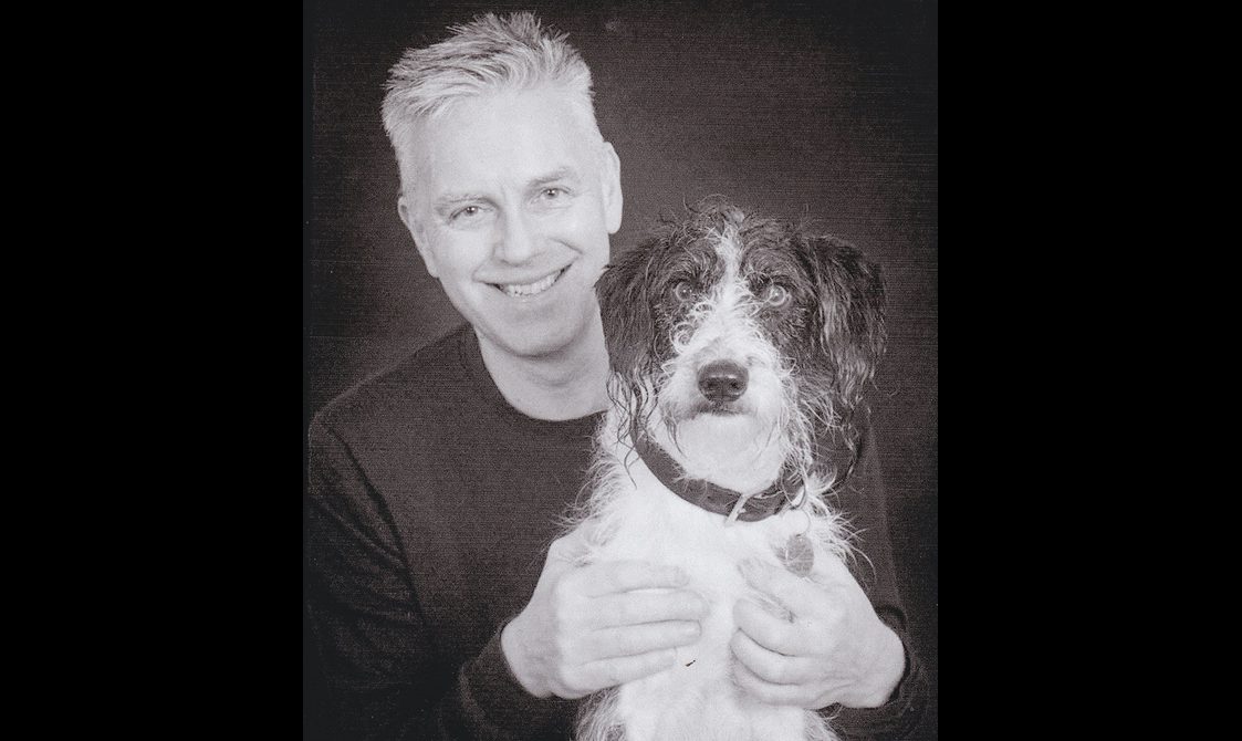 Portrait of Domhnall Uilleam Stiùbhart with a dog