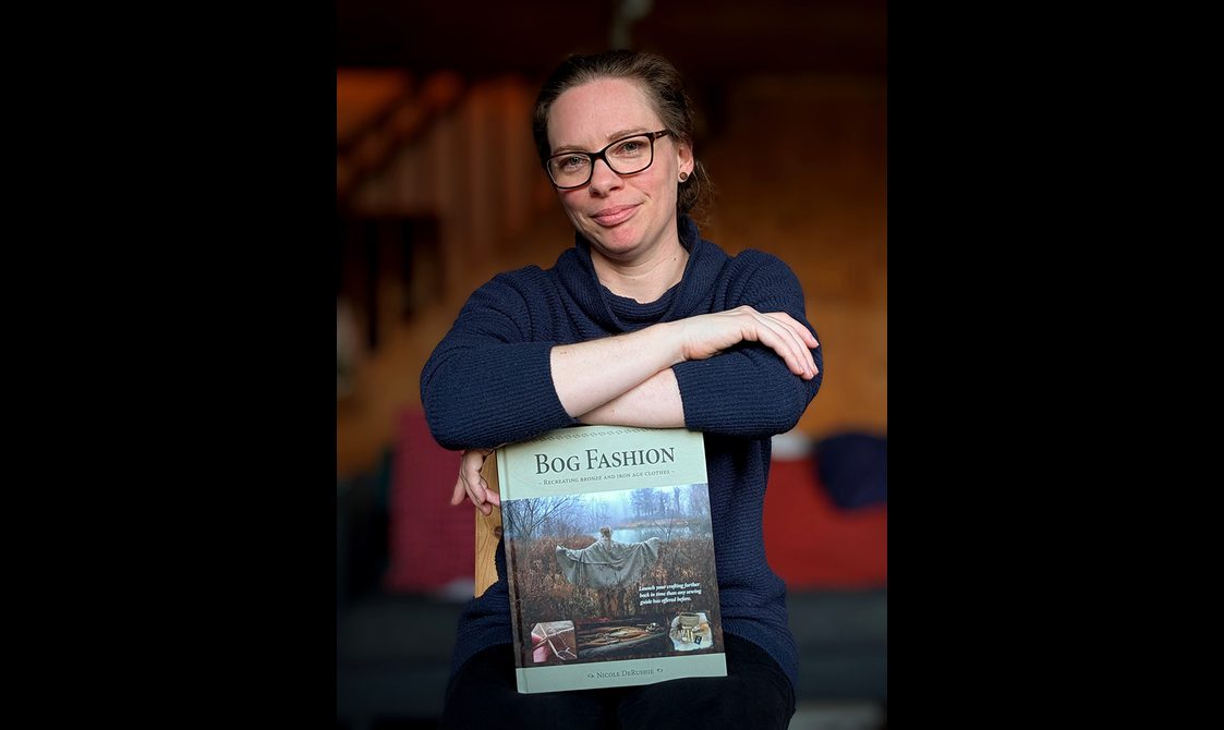 Portrait of Nicole De Rushie with her book 'Bog Fashion'.