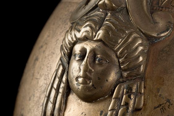 Bronze wine jug with a 3D Roman face engraving attached.