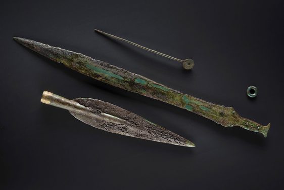 Preserved items from the Bronze Age Carnoustie Hoard, including a spearhead, sword, and pin.