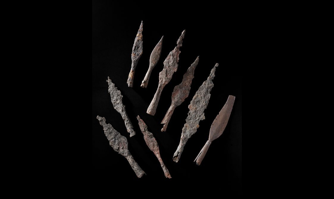 Roman iron spearheads, some which appear more corroded than others, but still identifiable as spear-shaped