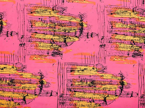 Colourful pink and yellow fabric with Trinidadian design.