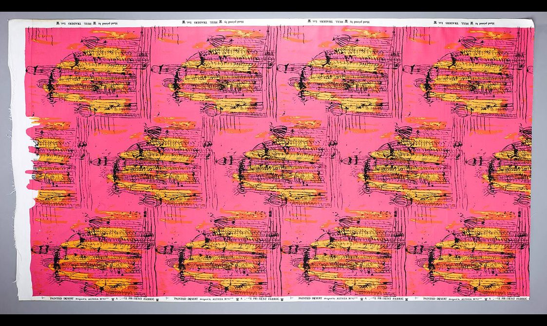Colourful pink and yellow fabric with Trinidadian design.