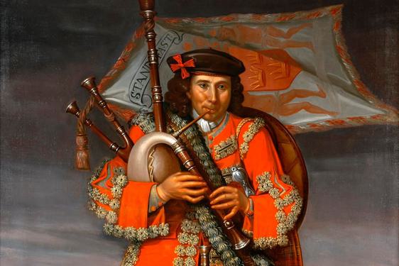 A portrait of a Scottish piper in traditional dress made up of red tartan.