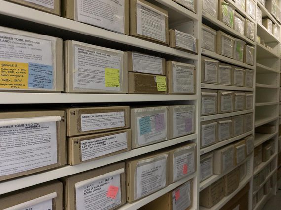 Rows of cardboard boxes in a museum store.