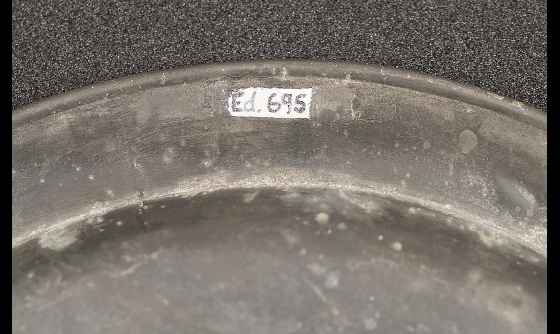 Close up of an object label applied with typing correction fluid.