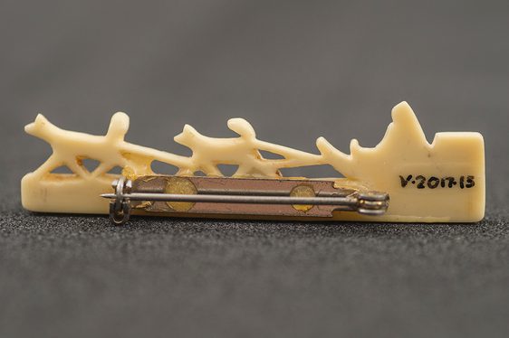 Close up of a written museum reference on an object.