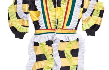 Multicoloured jacket with yellow and black horizontal stripes and white and yellow frills.