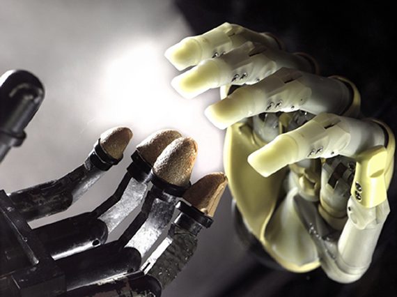 A colour photograph of two prosthetic hands. Both are made of an artificial material and have individual joints for each digit.