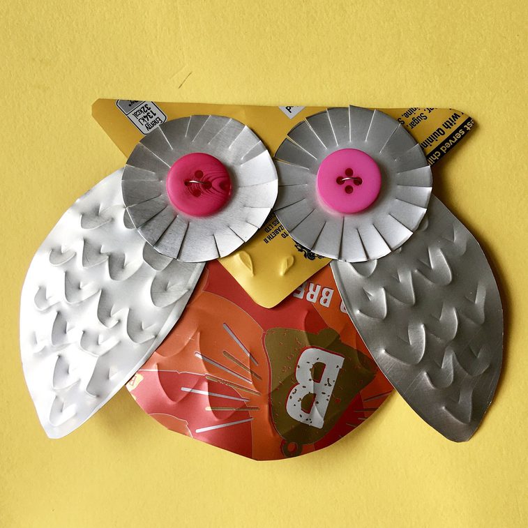 A stylish owl badge crafted from a fizzy drink can.